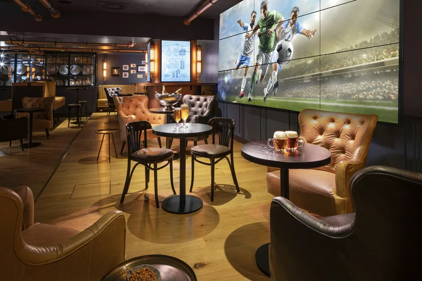 HILTON ATRIUM 12-2025 Hop House big screen JPG