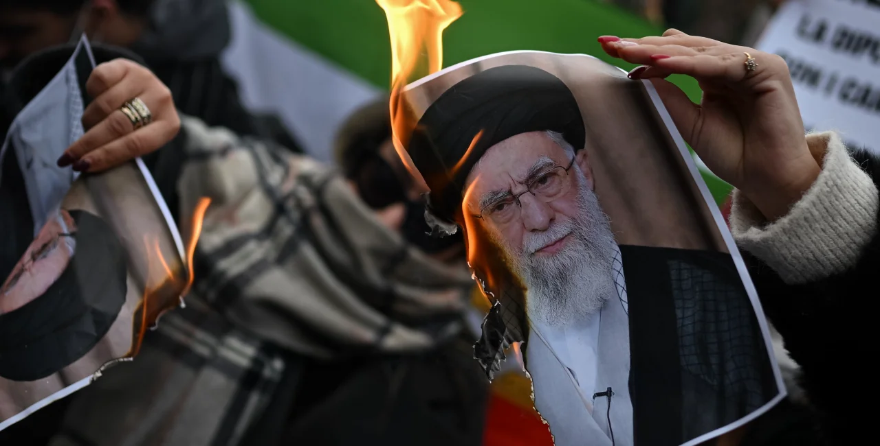 January 17, 2026: People burn a photo depicting Ali Khamenei, Supreme Leader of Iran. Photo: Shutterstock / pcruciatti