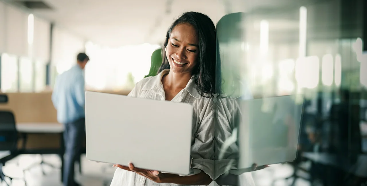 shutterstock_2673177473 woman notebook computer business office