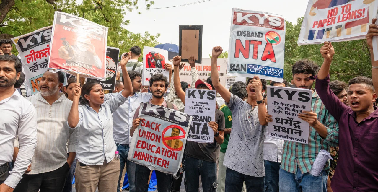 New Delhi, India. June 20 2026:  Protesters hold signs calling for the removal of the Education Minister. Photo: Shutterstock by PradeepGaurs
