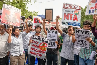 New Delhi, India. June 20 2026:  Protesters hold signs calling for the removal of the Education Minister. Photo: Shutterstock by PradeepGaurs