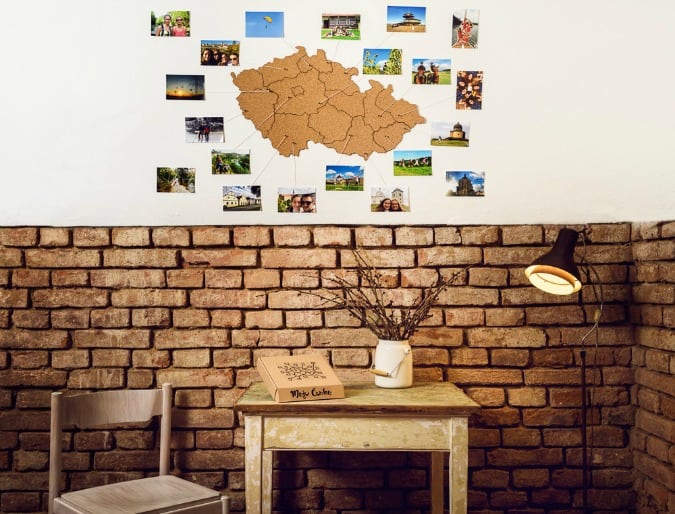 Cork board map shaped like the Czech republic hanging on a wall