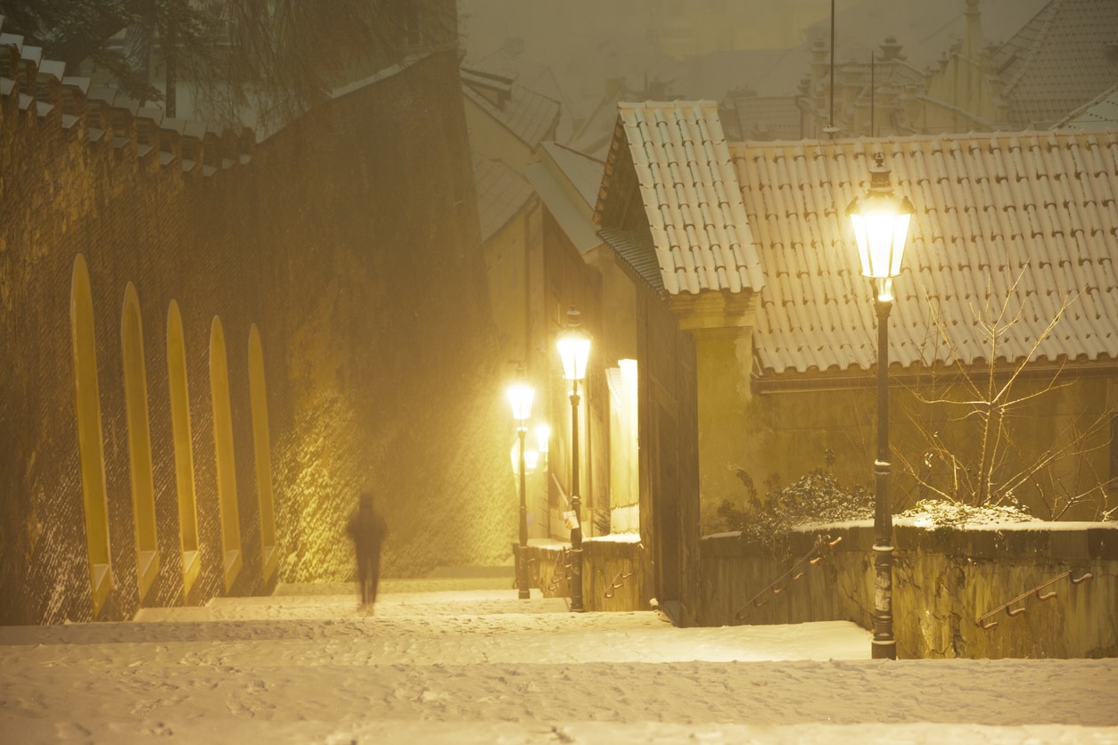 Snow-covered steps in Malá Strana leading up to Prague Castle.