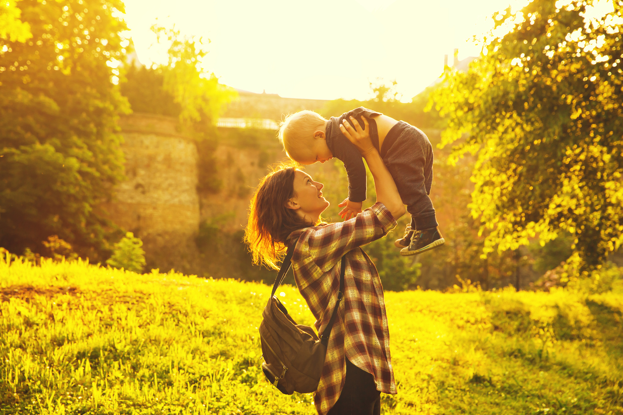 Young mother with her child at a park in Prague, Czech Republic